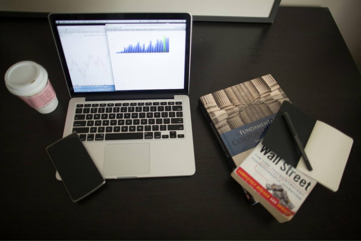 A computer and a phone on a table