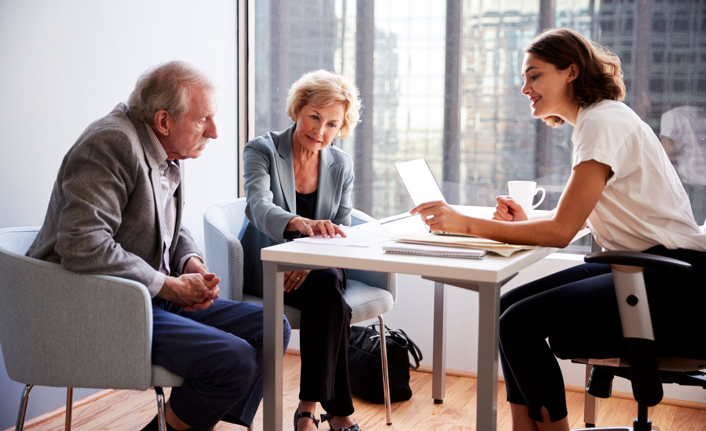 Three People Sitting and Having a Discussion