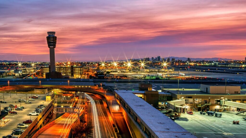 A city skyline with a train on the tracks