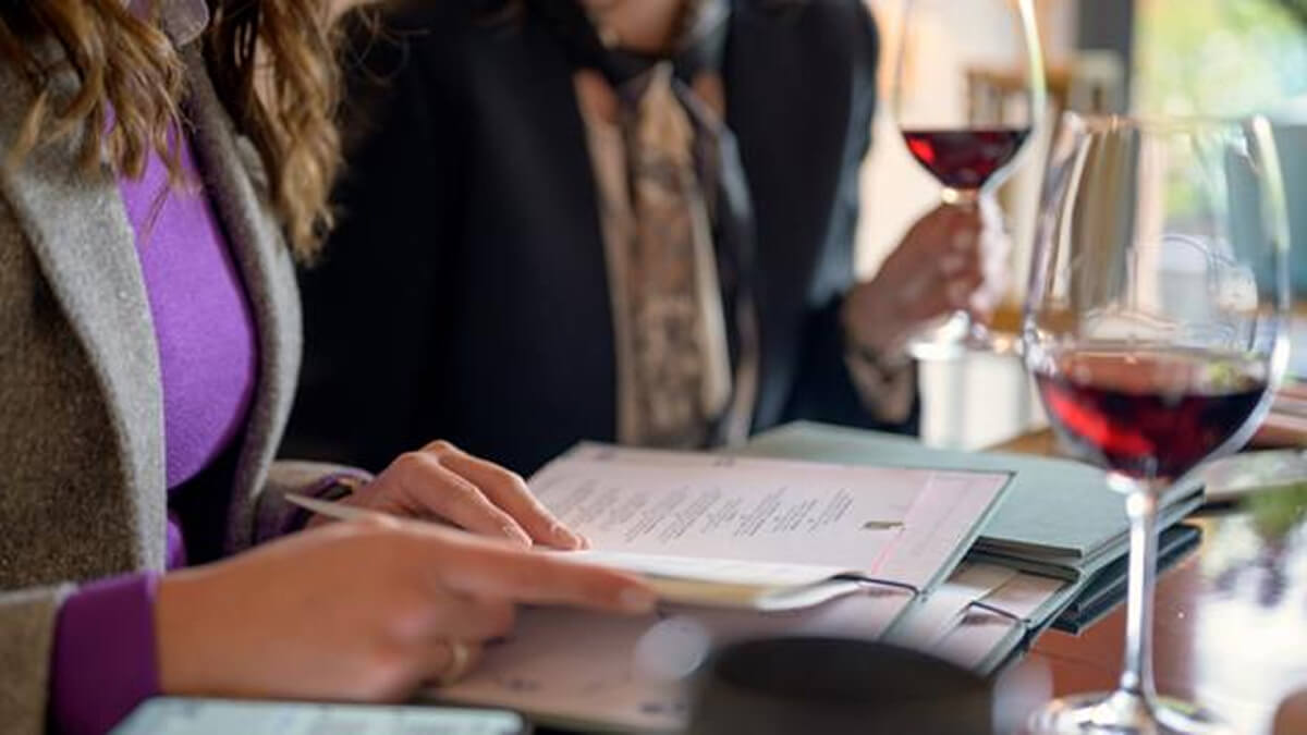 Woman Drinking Wine at Restaurant