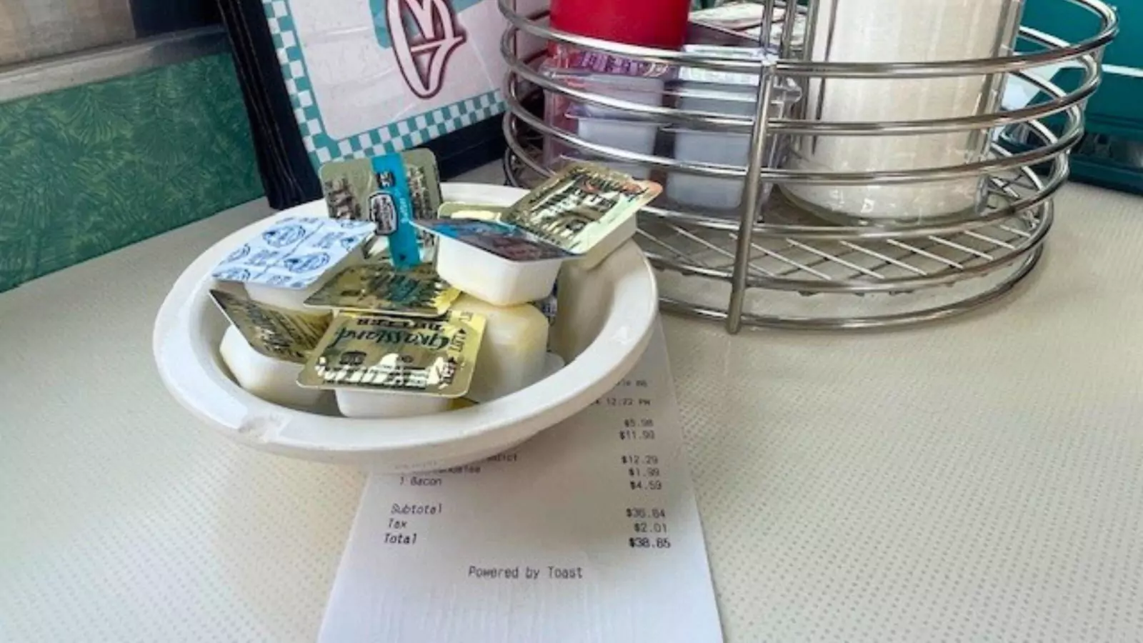 A bowl of condiments on a table
