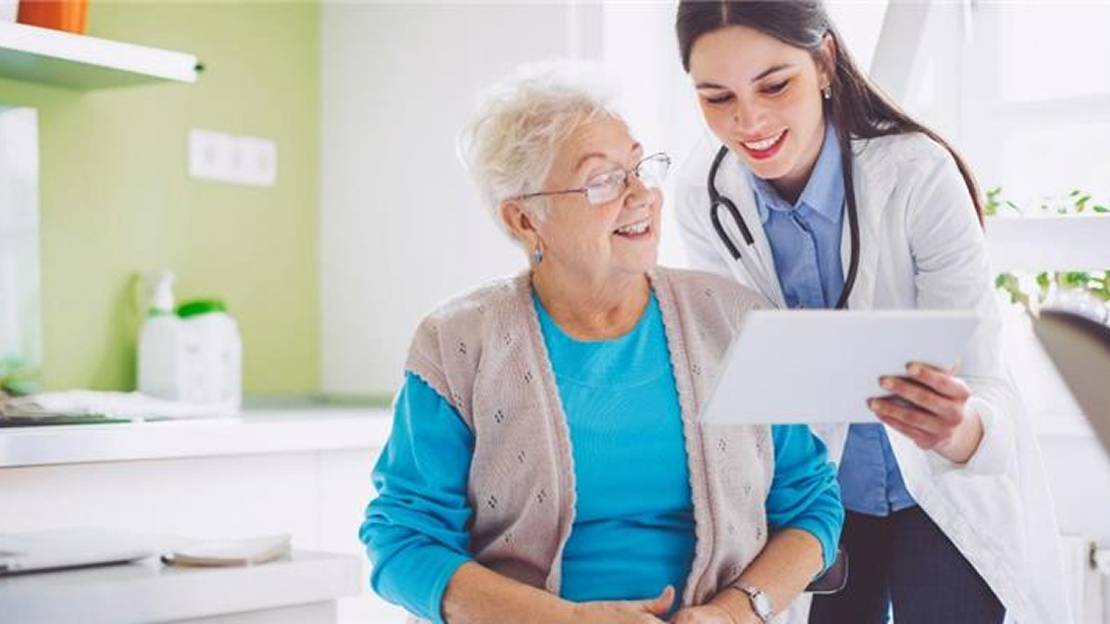 A Doctor and Patient Looking at a Tablet