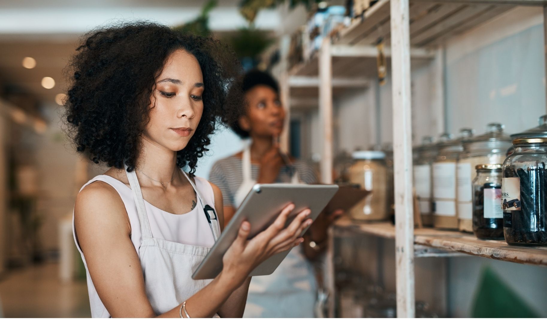 Business Owner Looking at the Tablet