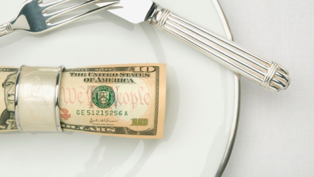 Dollar bill on a plate