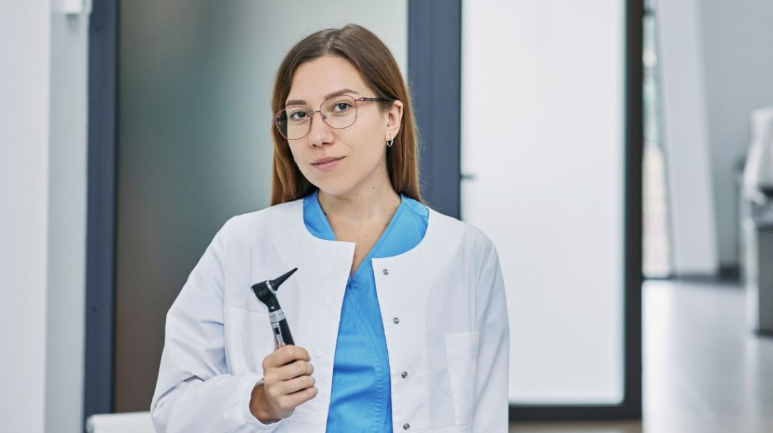 An Audiologist Holding Tools Used For Examining a Patient’s Ear