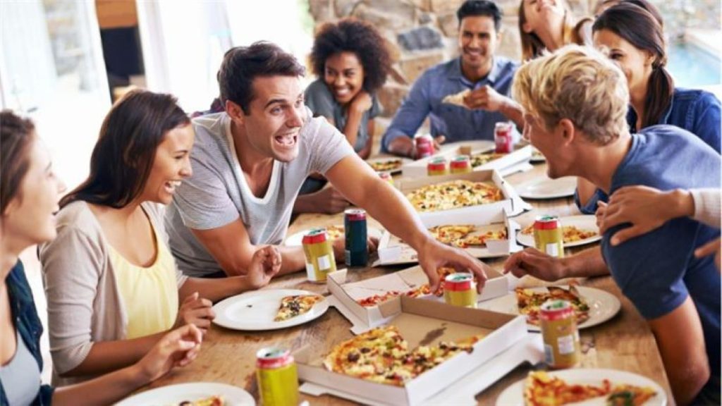 People enjoying pizza