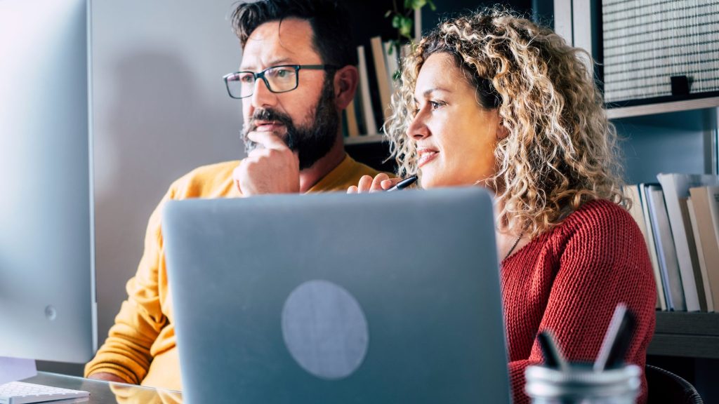 Two people listening to an advisor