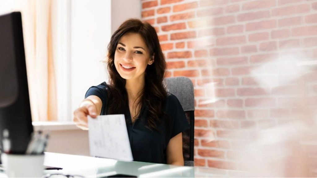 Woman Holding a Paycheck