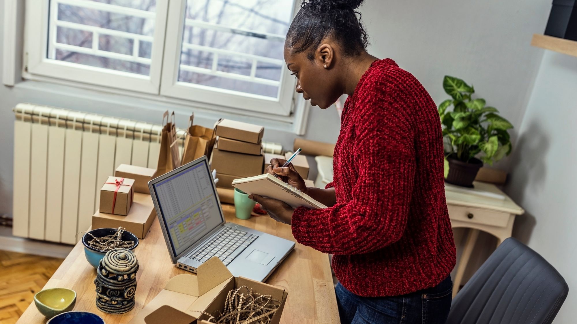 Woman Checking Her Checklist on a Laptop